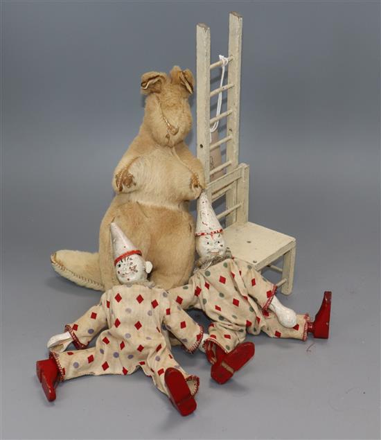 A plush kangaroo and two carved wood Pierrot toys